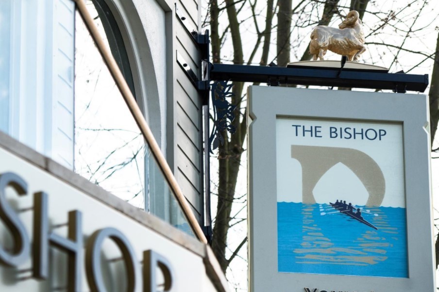 Outside area of the Bishop facing the riverside with tables and chairs