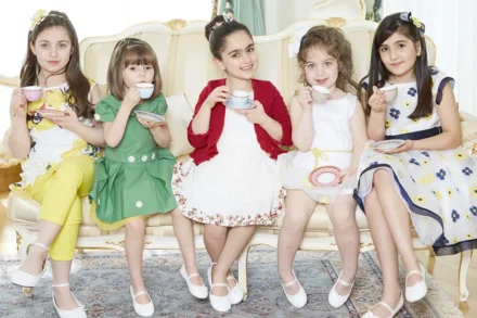 Little girls in princess dresses of various colours