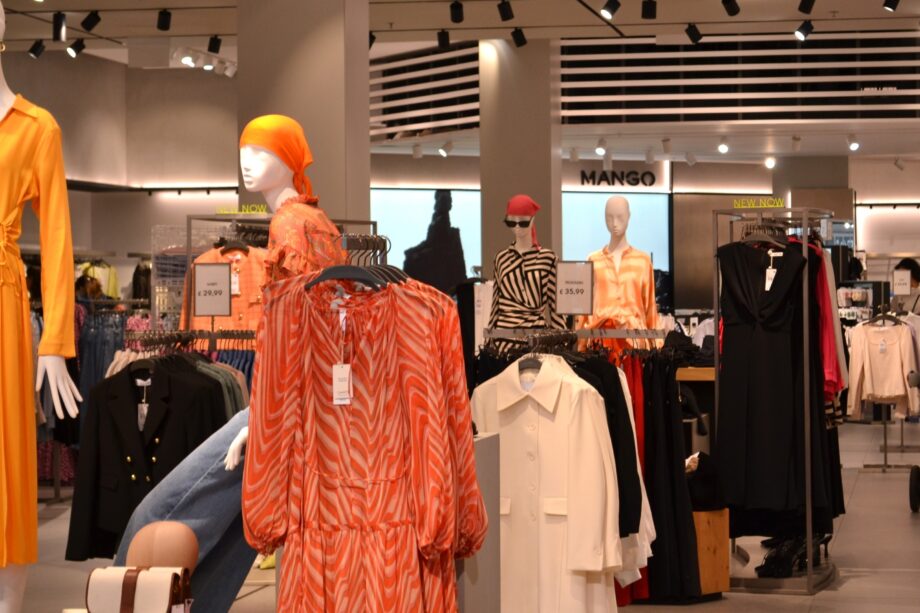 Image of front of mango store in Bentall centre in Kingston Upon Thames. Window features brand name and clothing display