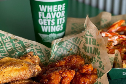Photo of outside Wingstop chain at dusk