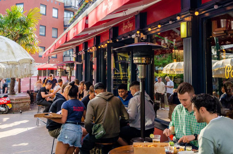 Patrons dine outside Poor Boys restaurant in Kingston on a summer's day